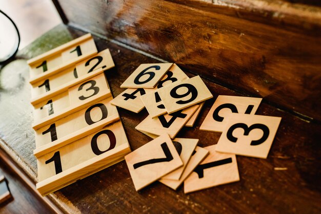 Wooden numbers in tables to learn mathematics in a Montessori classroom