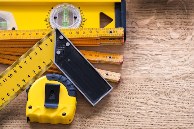 Wooden oaken board with objects of measurement construction concept