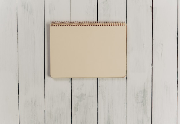 Wooden office desk table with notebook