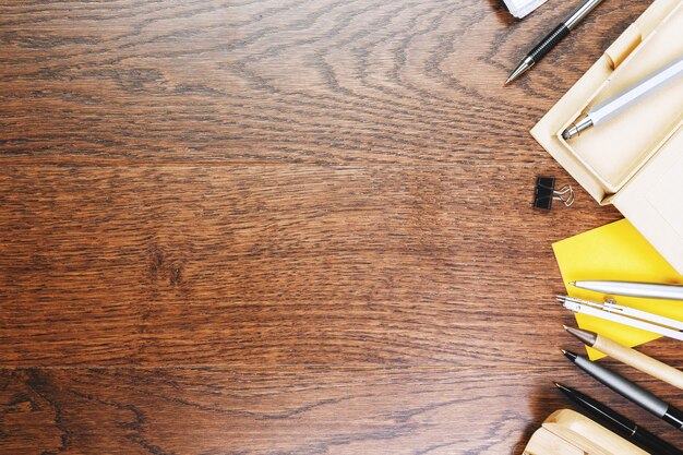 Photo wooden office desk with supplies