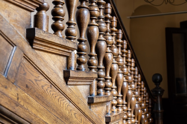 Wooden old decorative balusters, Ancient wooden stairs. decorative railings carved from wood