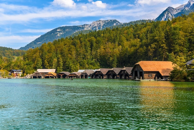 Wooden old houses on the lake Schoenau am Koenigssee Konigsee Berchtesgaden National Park Bavaria Germany