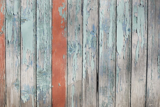 Wooden old shabby colored wall in full screen Photographed at close range