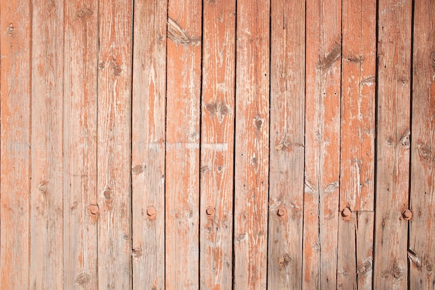 Wooden old shabby colored wall in full screen Photographed at close range