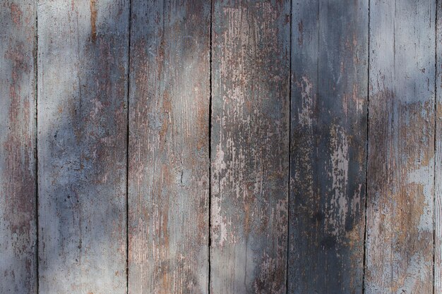 Wooden old shabby colored wall in full screen Photographed at close range