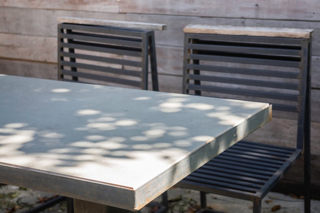 Wooden outdoors seats in summer garden