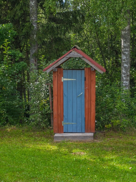 Wooden outhouse or wc toilet in a forest