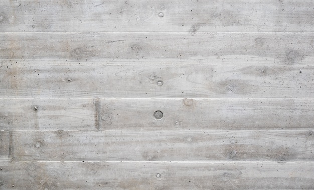 荒い灰色のコンクリートの壁に木製パレットテクスチャのスタイル