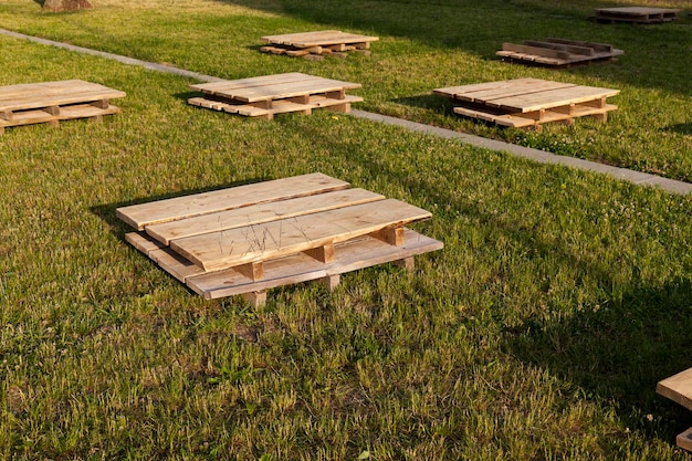 Wooden pallets on the grass, close up