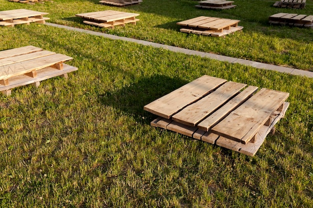 Wooden pallets on the grass, close up