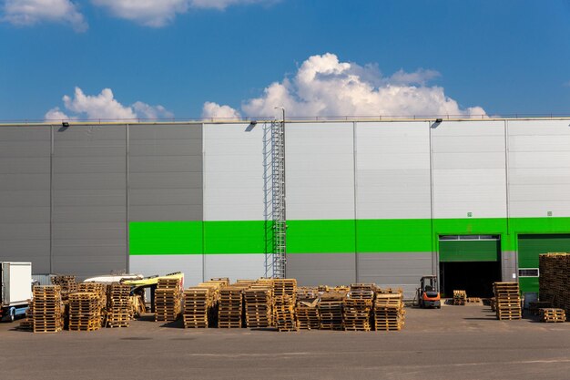 Wooden pallets heap in the cargo warehouse for transportation and logistics