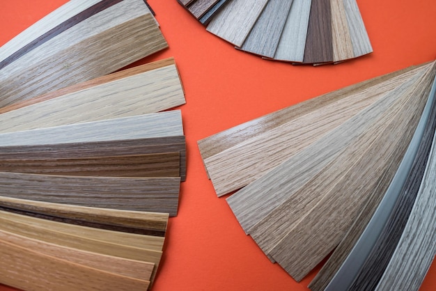 Wooden parquet floor sample interior material isolated on\
orange background