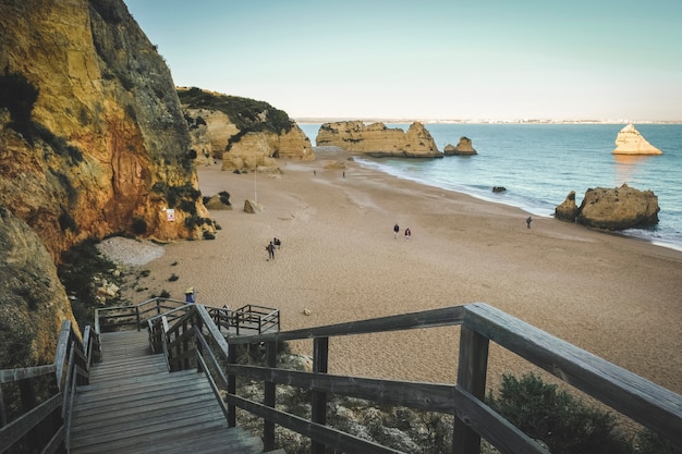 Wooden path to the beach of the atlantic ocean in the city of Lagos in Portugal