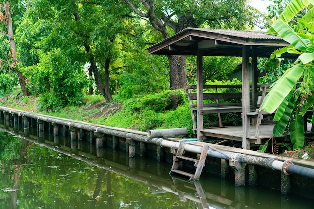 wooden pavilion by side the little canal