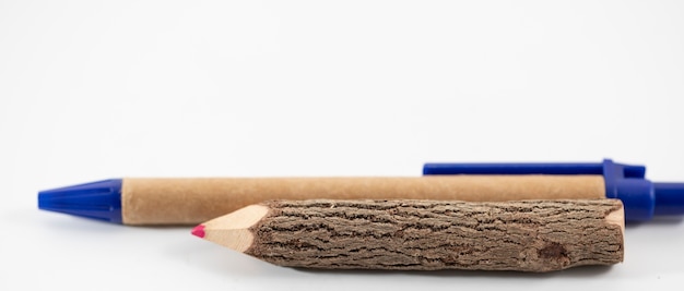 Wooden pencil and pen on the white background