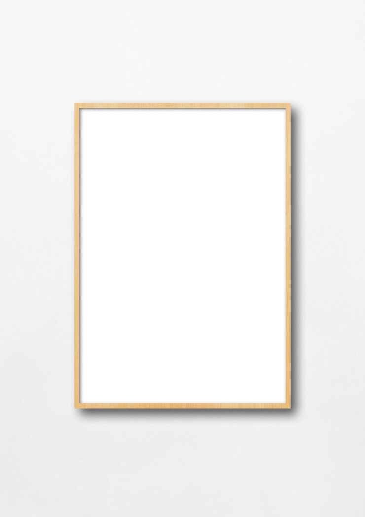 Photo wooden picture frame hanging on a white wall.
