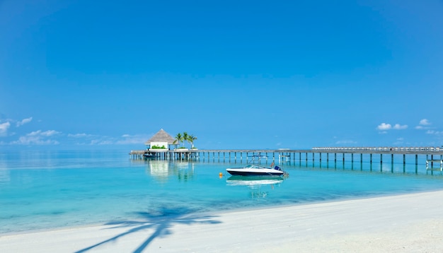 Wooden pier over blue sea water, summer tropical concept