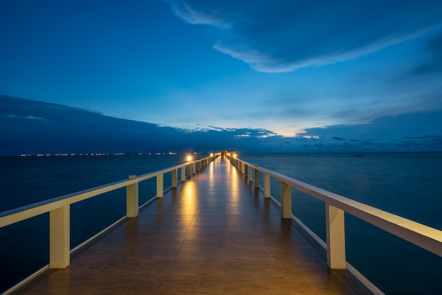 Wooden pier between sunset in Phuket, Thailand. Summer, Travel, Vacation and Holiday concept.