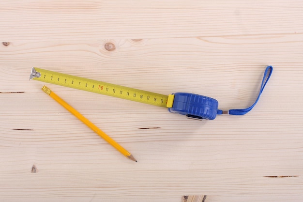 Wooden plank and measuring tape