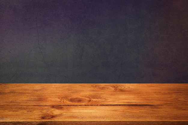 Wooden plank with black textured background