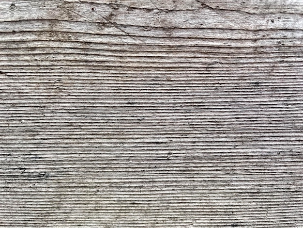 A wooden plank with a rough texture.