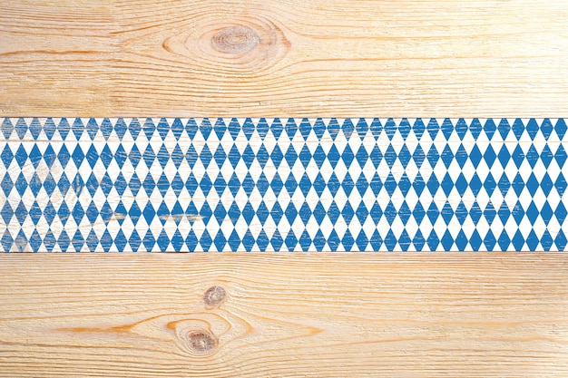 Wooden planks painted blue and white rhombs