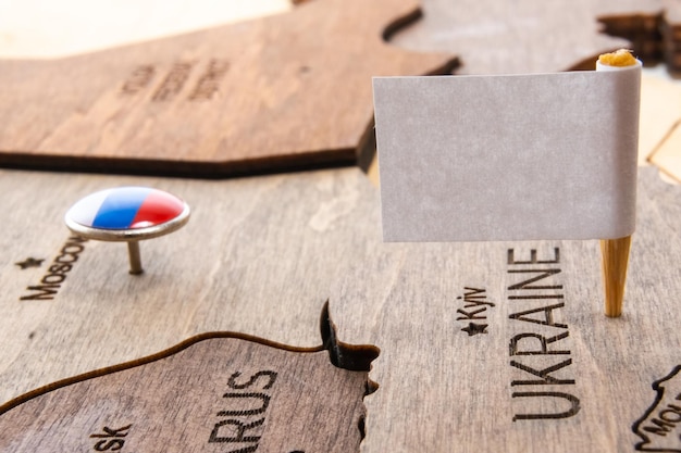 A wooden plaque with a name tag that says ukraine on it