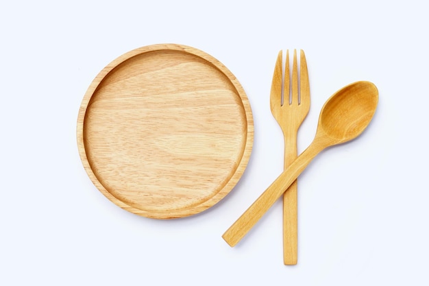 Wooden plate with spoon and fork