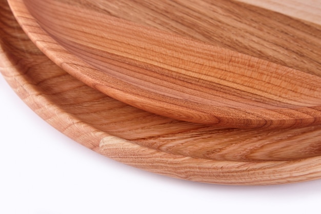 Wooden plates on a white background