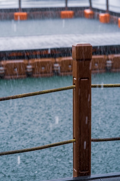 Wooden pole with mooring rope under the heavy rain tourism monsoon and tropical country