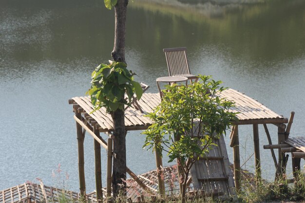 Wooden post on pier by lake