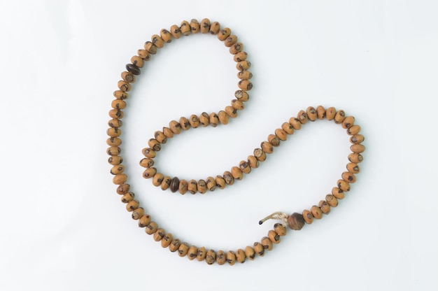 Wooden prayer beads isolated on a white background