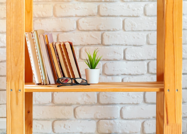 Wooden rack shelf with home decor stuff