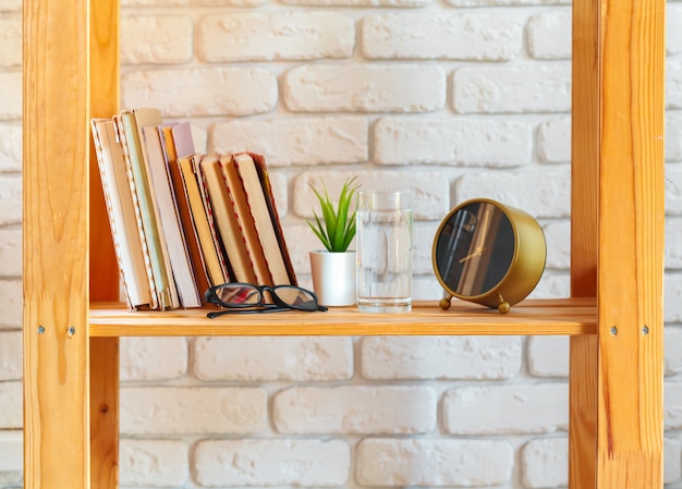 Wooden rack shelf with home decor stuff