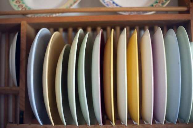 Wooden rack with assorted colorful plates