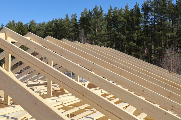 Wooden rafters of roofs construction of frame house in rural areas texture surface