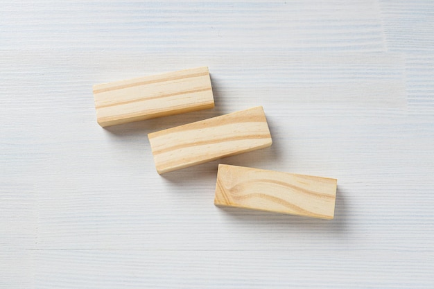 Wooden rectangles on white wooden background space for text