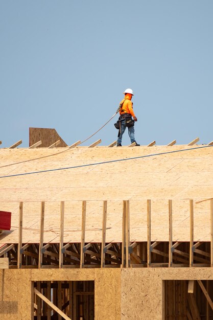 Wooden roof beam from framework house roof at construction site roofer working on roof structure of