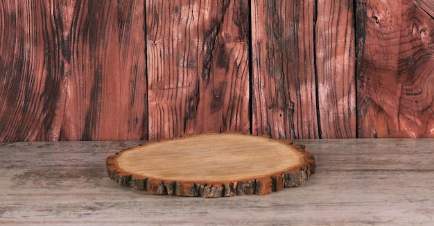 wooden round board podium on a wooden table