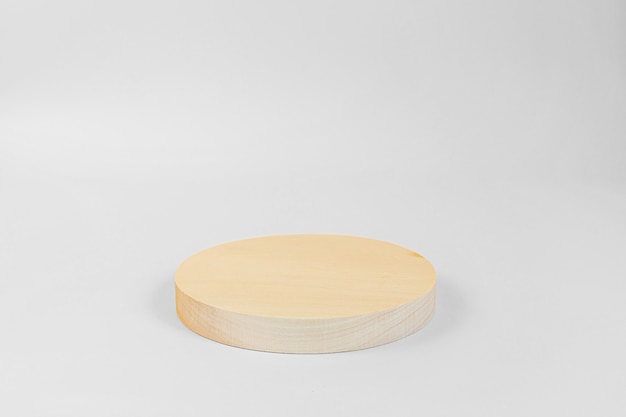 Wooden round podium isolated on white