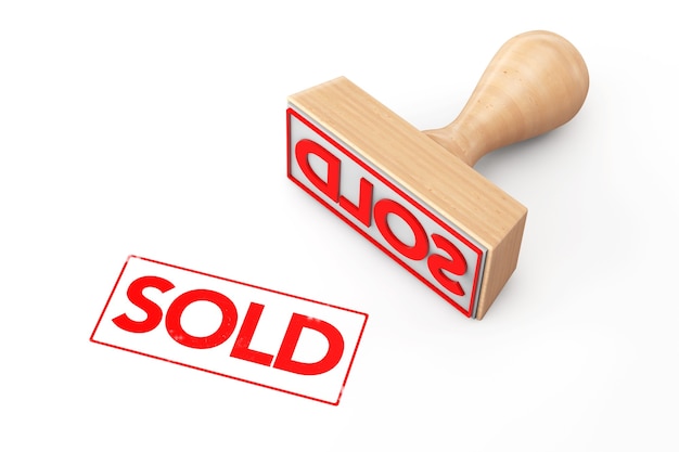 Wooden Rubber Stamp with Sold Sign on a white background