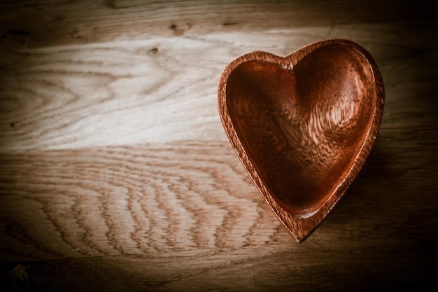 Wooden salad bowl in the shape of heart