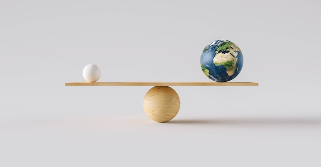 wooden scale balancing Earth ball and one small ball. Concept of harmony and balance