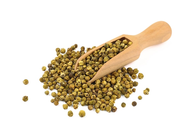 Wooden scoop full of green peppercorns