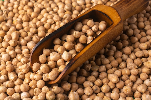 Wooden scoop with chickpea