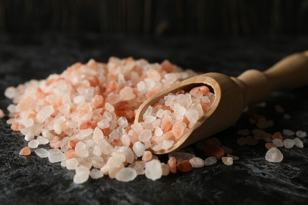 Wooden scoop with pink Himalayan salt