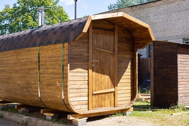 Wooden shed in the yard in summer