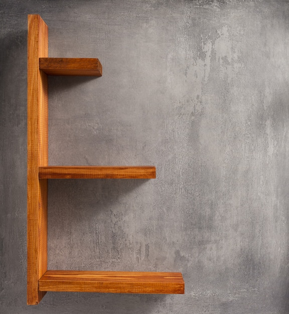 Photo wooden shelf and concrete wall