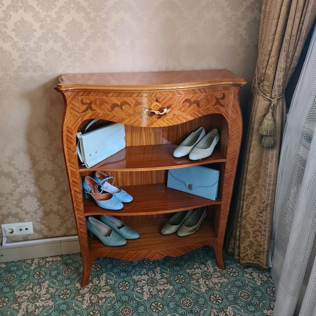 A wooden shelf with shoes on it