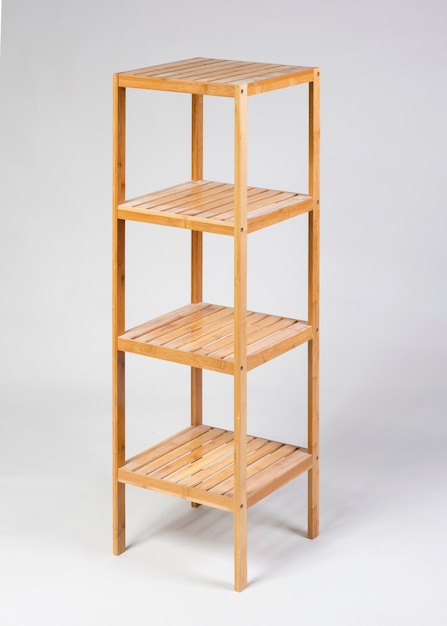 Wooden shelves unit isolated on gray background